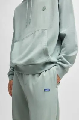 Cotton-terry tracksuit bottoms with blue logo patch