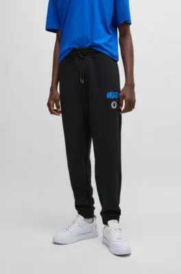 Cotton-terry tracksuit bottoms with Happy HUGO logo