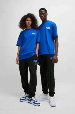 Cotton-terry tracksuit bottoms with Happy HUGO logo