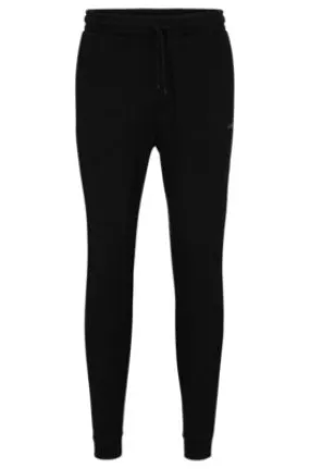 Cotton tracksuit bottoms with curved logo