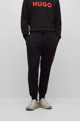 Cuffed tracksuit bottoms in French terry with contrast logo