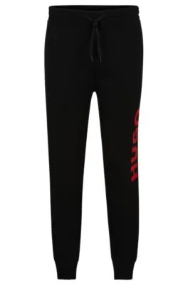 Cuffed tracksuit bottoms in French terry with contrast logo